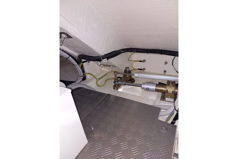  Yacht Photos Pics Engine room of 2021 Ferretti Yachts 670, showcasing mechanical components and wiring.