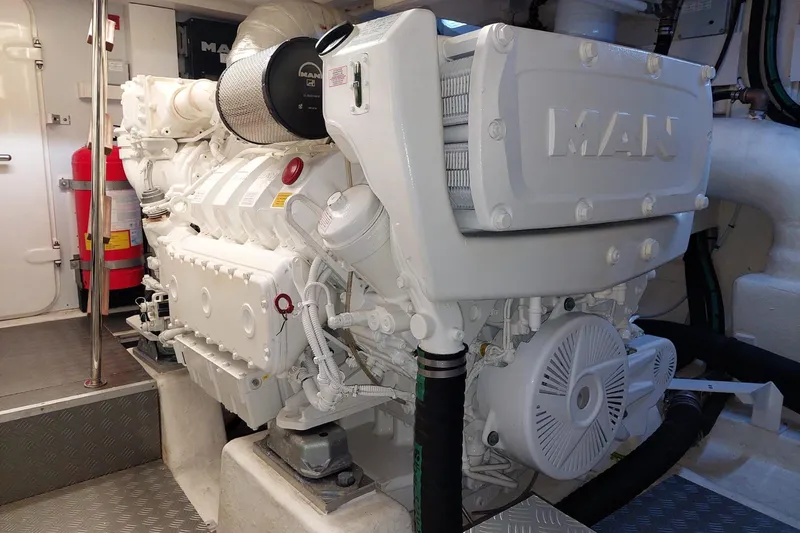  Yacht Photos Pics Engine room of 2021 Ferretti Yachts 670 with MAN engine, showcasing mechanical details.