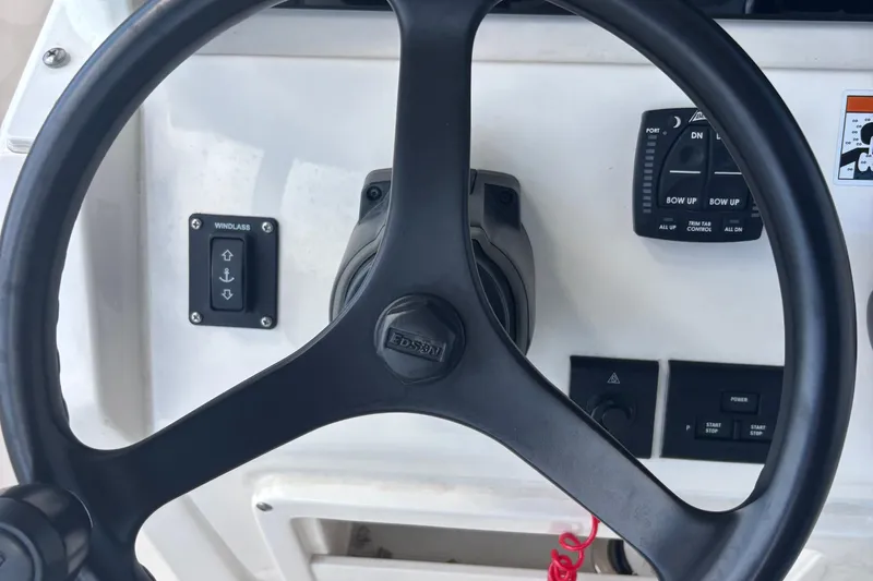  Yacht Photos Pics Steering wheel and controls of 2022 Cobia 280 Center Console boat.