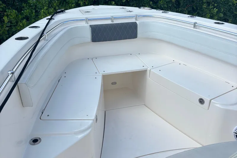  Yacht Photos Pics 2022 Cobia 280 Center Console boat interior with seating and storage compartments.