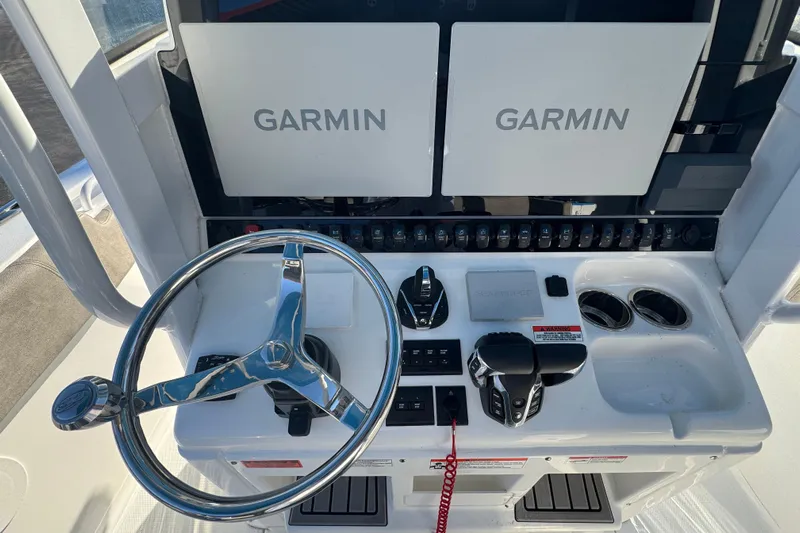  Yacht Photos Pics 2024 Sea Hunt Ultra 305 SE helm with dual Garmin displays and modern controls.