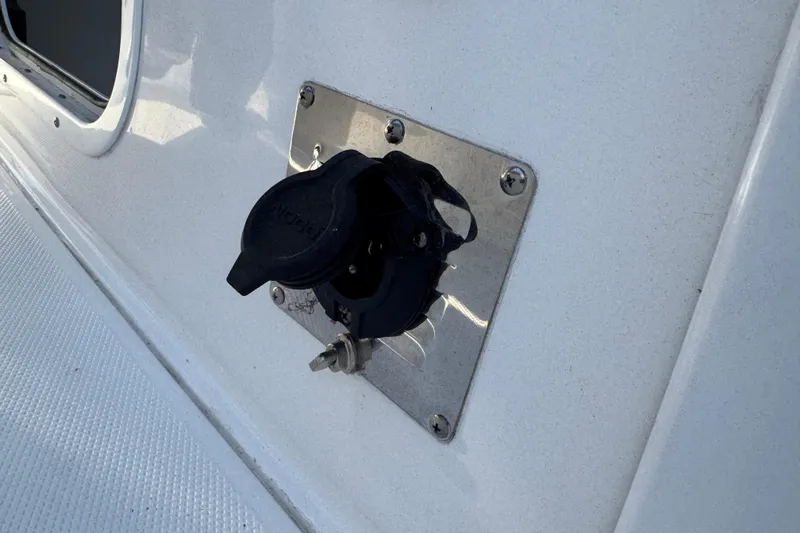  Yacht Photos Pics 2024 Sea Hunt Ultra 305 SE boat power outlet on white surface.
