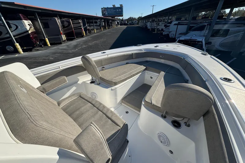  Yacht Photos Pics 2024 Sea Hunt Ultra 305 SE boat interior with cushioned seating and storage compartments.