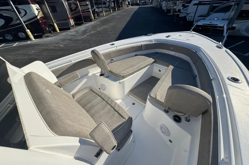  Yacht Photos Pics 2024 Sea Hunt Ultra 305 SE boat interior with cushioned seating and storage compartments.