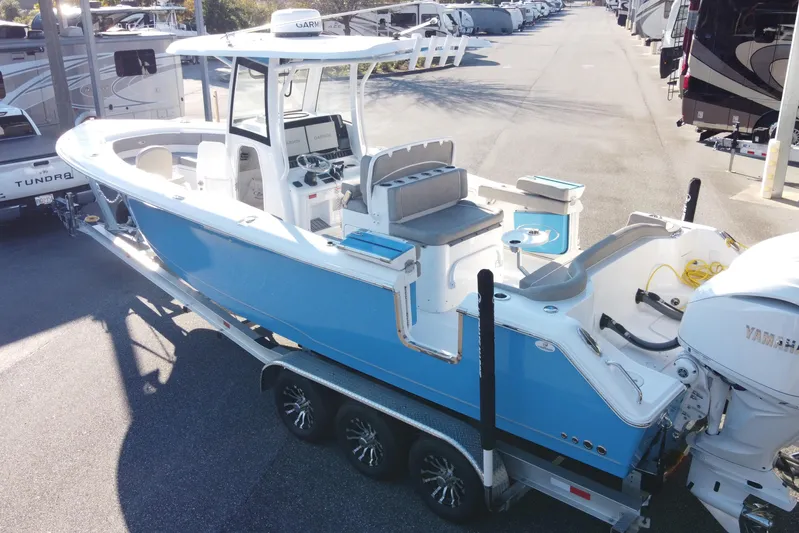  Yacht Photos Pics 2024 Sea Hunt Ultra 305 SE boat on trailer, featuring sleek design and modern amenities.