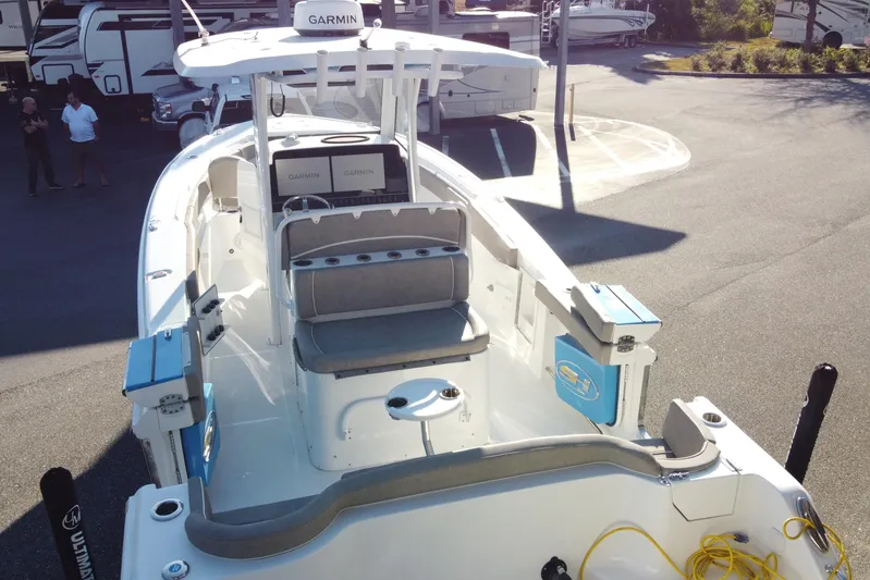  Yacht Photos Pics 2024 Sea Hunt Ultra 305 SE boat with Garmin electronics, parked outdoors.