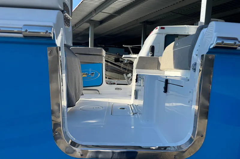  Yacht Photos Pics 2024 Sea Hunt Ultra 305 SE boat interior with blue and white seating.