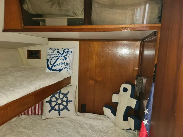 Relentless Yacht Photos Pics Cozy cabin interior of 1993 Tiara Yachts 4300 Convertible with nautical-themed decor.