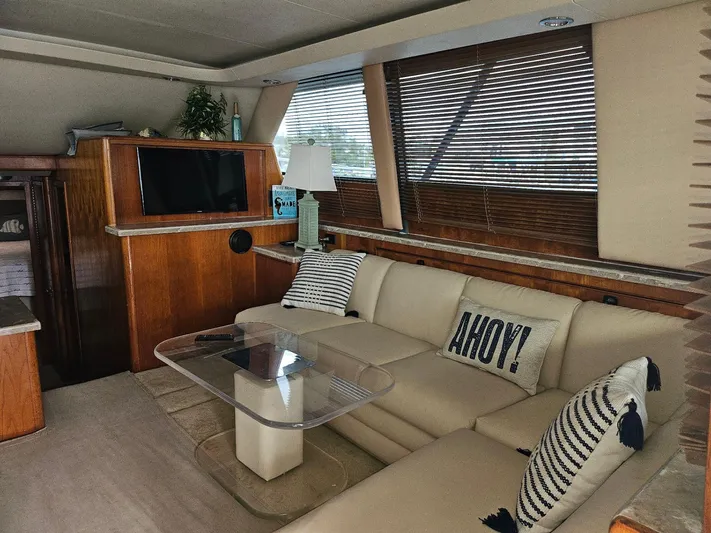 Relentless Yacht Photos Pics Luxurious interior of 1993 Tiara Yachts 4300 Convertible with cozy seating and nautical decor.