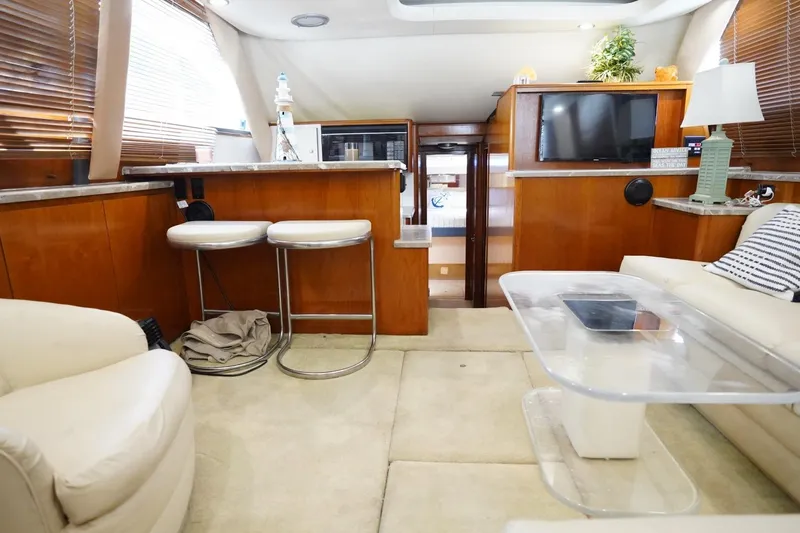 Relentless Yacht Photos Pics Luxurious interior of 1993 Tiara Yachts 4300 Convertible with modern furnishings and decor.