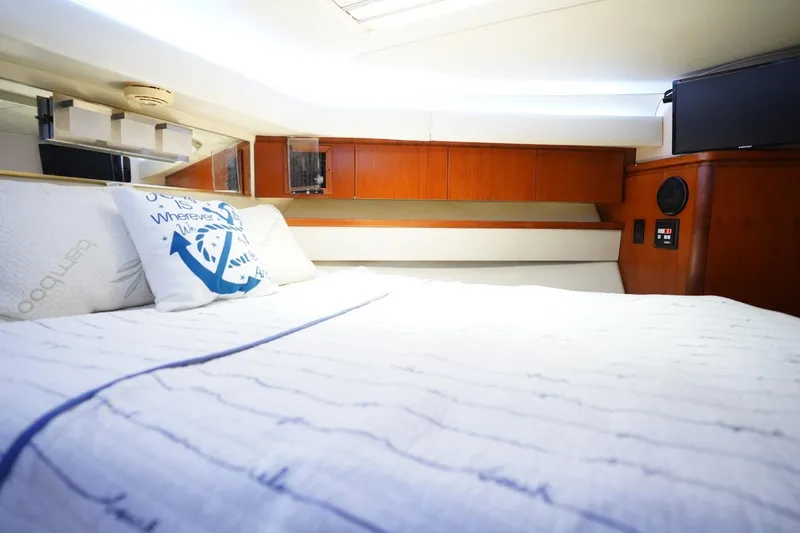 Relentless Yacht Photos Pics Luxurious cabin interior of 1993 Tiara Yachts 4300 Convertible with cozy bedding.