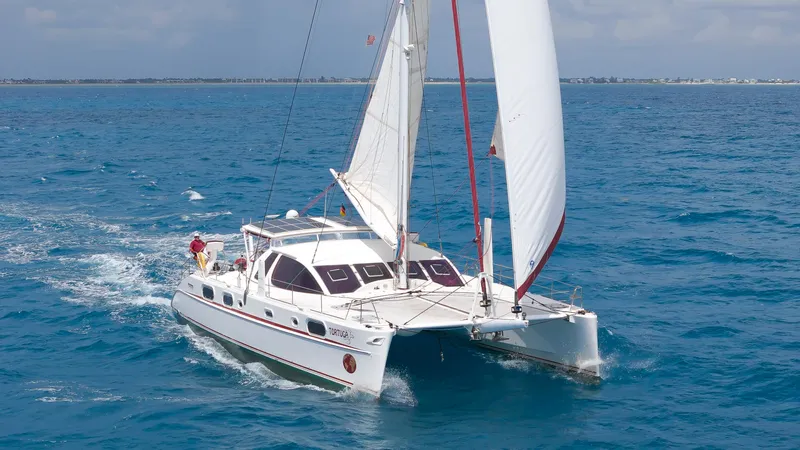 Tortuga Yacht Photos Pics Sailing Catana 582 catamaran from 2001 on open blue sea.