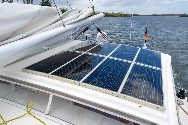 Tortuga Yacht Photos Pics Solar panels on a 2001 Catana 582 yacht, sailing on a calm lake.