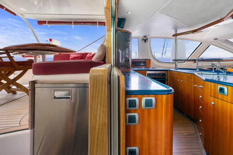 Tortuga Yacht Photos Pics Luxurious Catana 582 yacht interior with modern kitchen and outdoor seating, 2001 model.