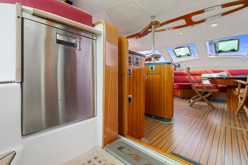 Tortuga Yacht Photos Pics Interior of 2001 Catana 582 yacht with wood flooring and modern seating area.
