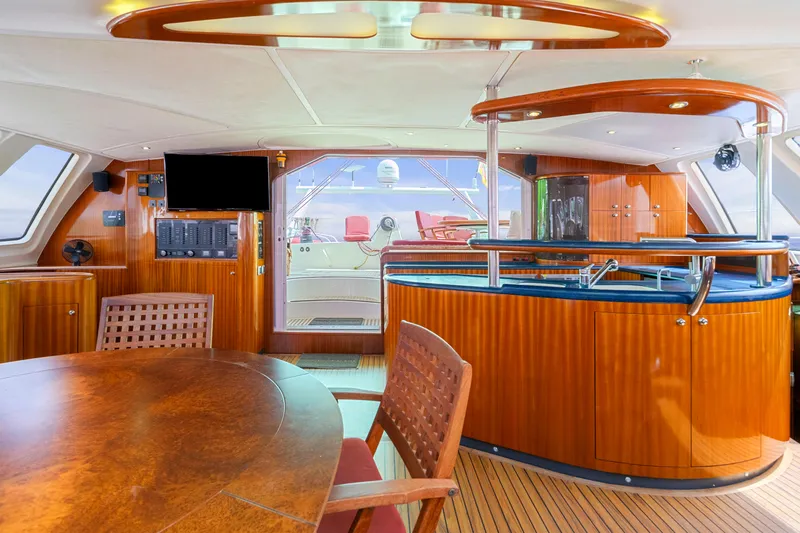 Tortuga Yacht Photos Pics Luxurious interior of a 2001 Catana 582 yacht with elegant wood finishes and modern amenities.