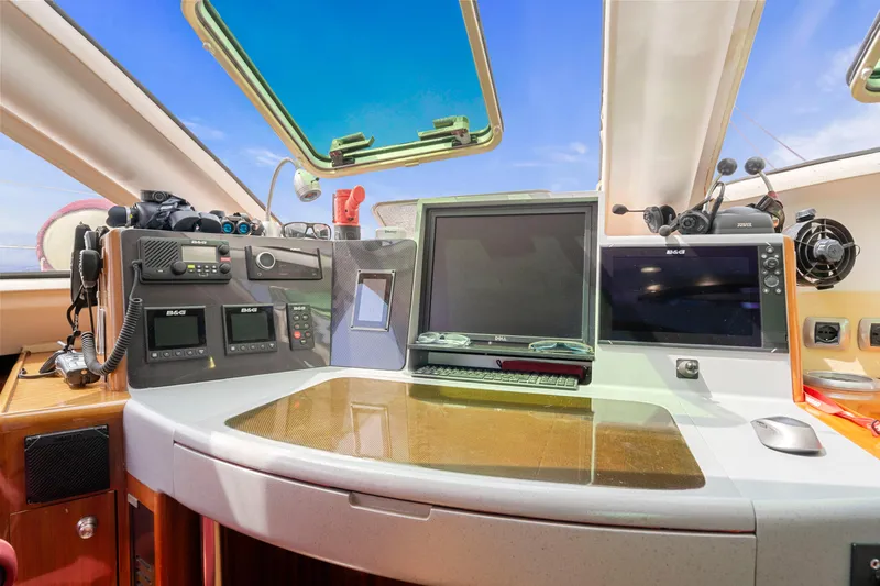 Tortuga Yacht Photos Pics Catana 582 yacht cockpit with navigation equipment, 2001 model, featuring modern controls and displays.