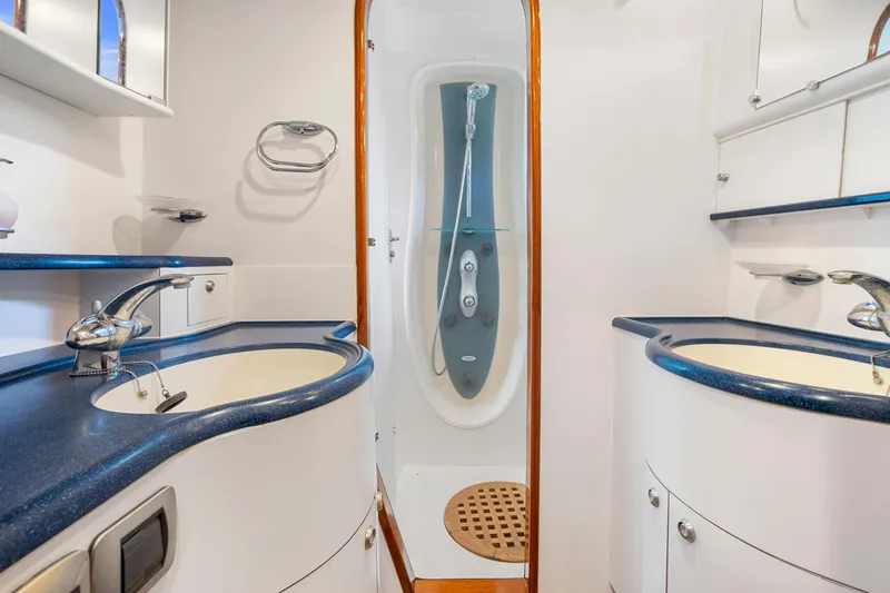 Tortuga Yacht Photos Pics Luxurious Catana 582 yacht bathroom with dual sinks and modern shower, 2001 model.