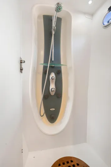 Tortuga Yacht Photos Pics Modern shower unit in a 2001 Catana 582 yacht, featuring sleek design and adjustable showerhead.