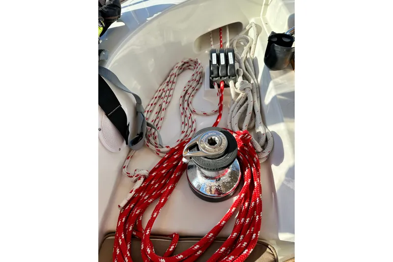 Eos Yacht Photos Pics Sailing equipment on a 2006 Passport 470 yacht, featuring ropes and a winch.