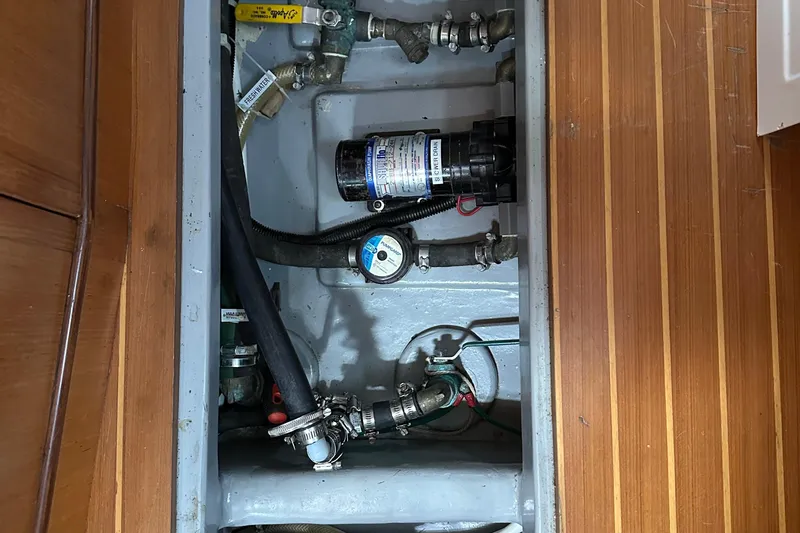 Eos Yacht Photos Pics Boat plumbing system in a 2006 Passport 470, featuring pipes and a pump.