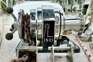 Eos Yacht Photos Pics Chrome winch on 2006 Passport 470 sailboat deck, featuring chain and control levers.