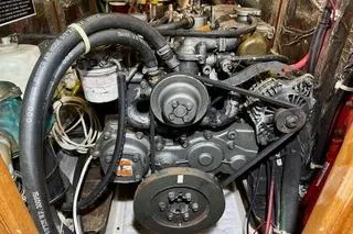 Eos Yacht Photos Pics Engine of a 2006 Passport 470 boat, showcasing mechanical components and hoses.