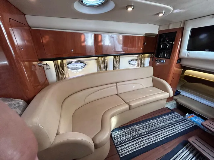  Yacht Photos Pics Luxurious interior of a 2015 Crownline 350 SY yacht with elegant seating and modern amenities.