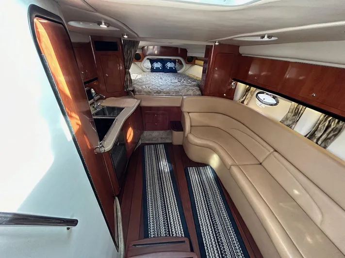  Yacht Photos Pics Luxurious interior of 2015 Crownline 350 SY yacht with leather seating and kitchenette.