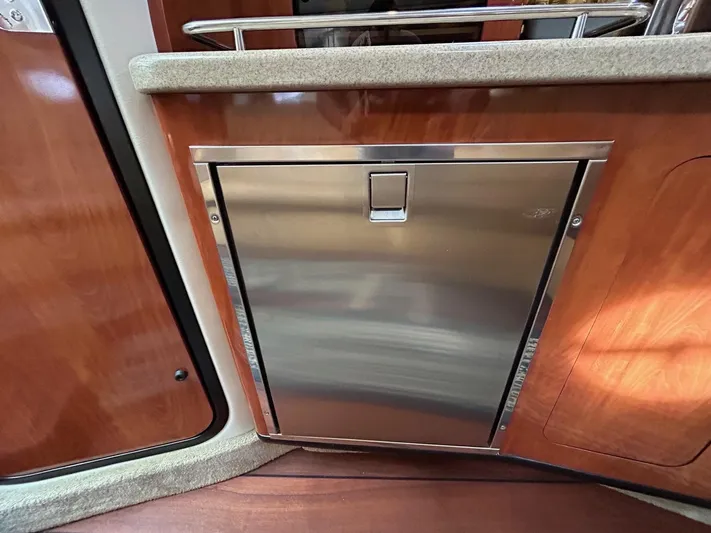  Yacht Photos Pics Stainless steel refrigerator in 2015 Crownline 350 SY yacht interior.