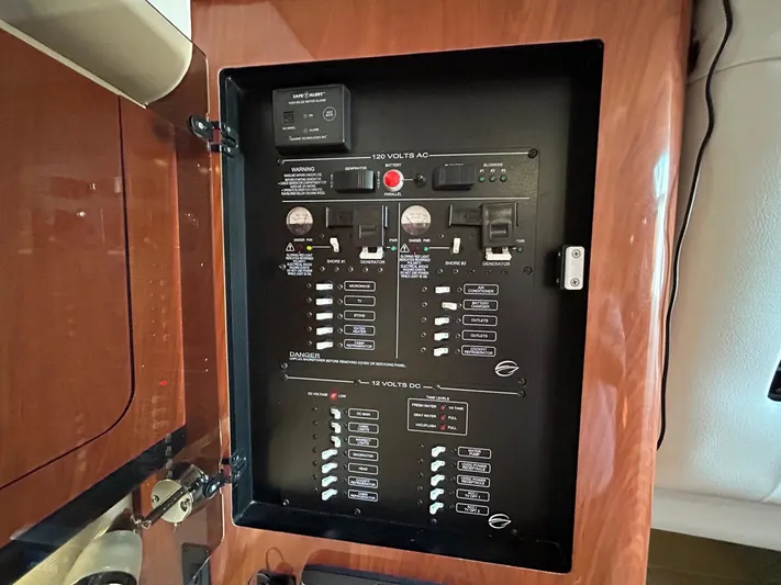  Yacht Photos Pics Electrical panel inside 2015 Crownline 350 SY boat, featuring various switches and controls.