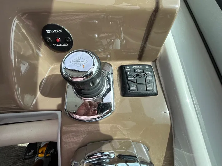  Yacht Photos Pics Control panel of a 2015 Crownline 350 SY boat with joystick and buttons.