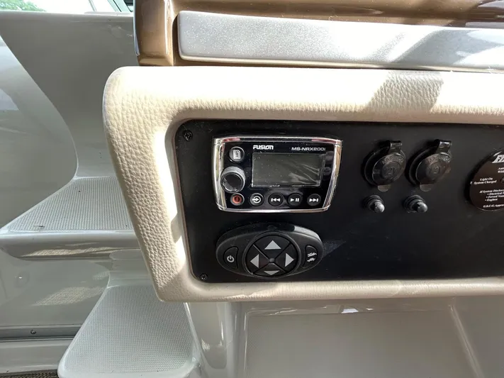  Yacht Photos Pics Control panel of 2015 Crownline 350 SY boat with audio system and switches.