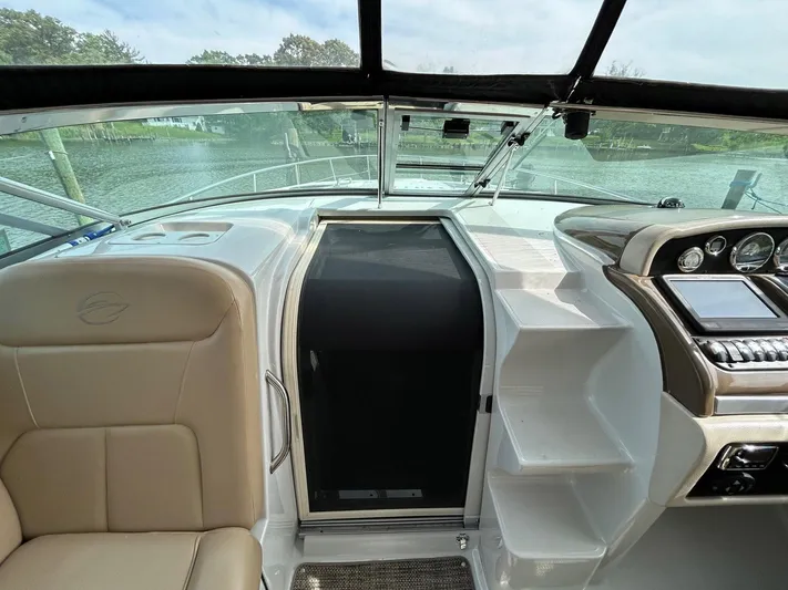  Yacht Photos Pics 2015 Crownline 350 SY yacht interior with helm, seating, and dashboard.