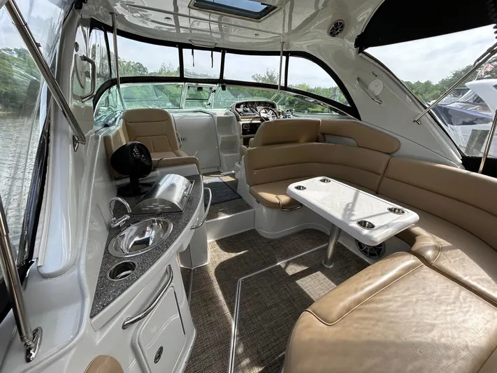  Yacht Photos Pics Interior of 2015 Crownline 350 SY yacht with seating, table, and helm.