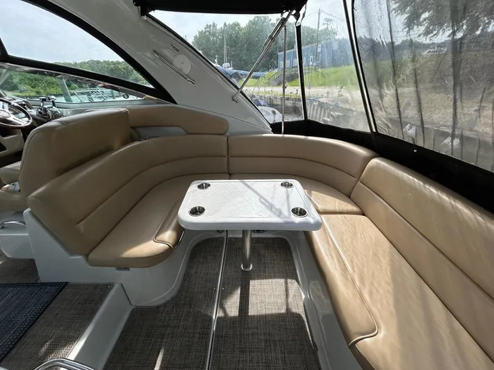  Yacht Photos Pics 2015 Crownline 350 SY yacht interior with tan seating and table.