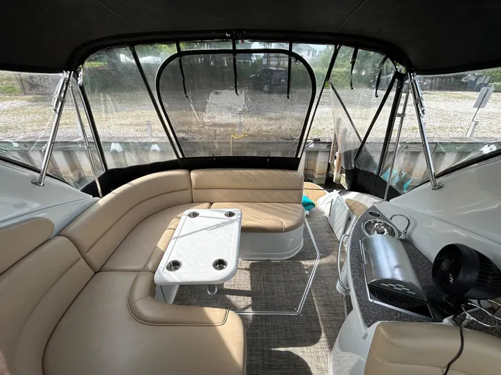  Yacht Photos Pics Interior of 2015 Crownline 350 SY boat with beige seating and table.