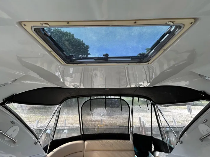  Yacht Photos Pics Interior view of 2015 Crownline 350 SY boat with sunroof and seating area.