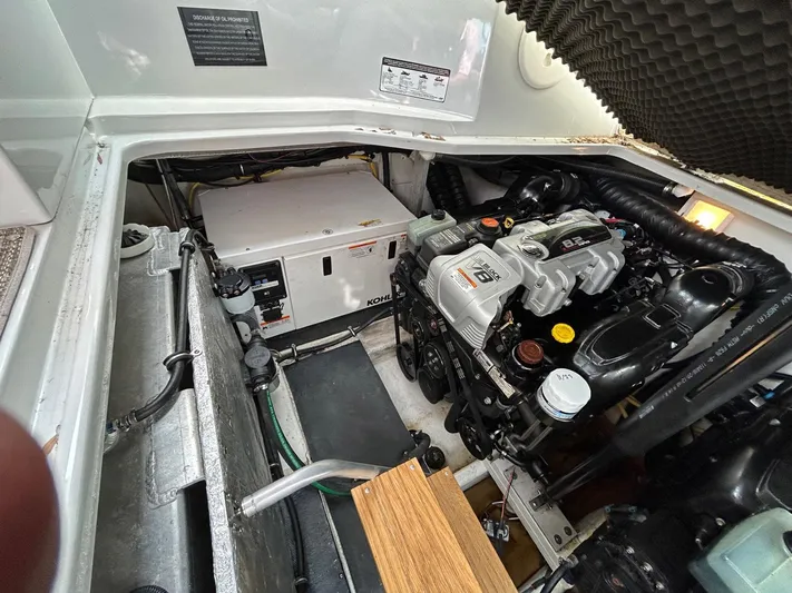  Yacht Photos Pics Engine compartment of a 2015 Crownline 350 SY boat, showcasing mechanical components.