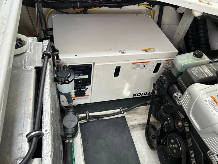  Yacht Photos Pics Engine compartment of 2015 Crownline 350 SY with Kohler generator visible.
