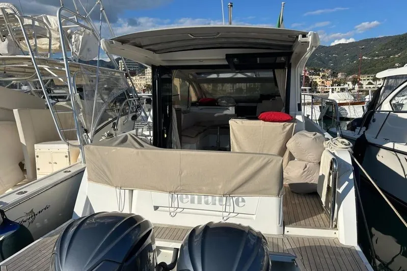  Yacht Photos Pics 2022 Sealine C335V yacht docked at marina, featuring spacious deck and modern design.