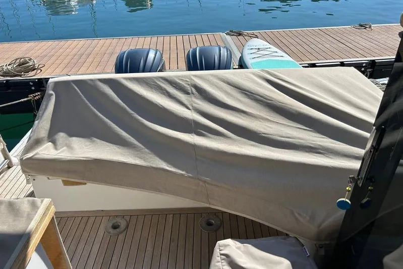  Yacht Photos Pics Sealine C335V 2022 boat deck with covered seating and dock view.