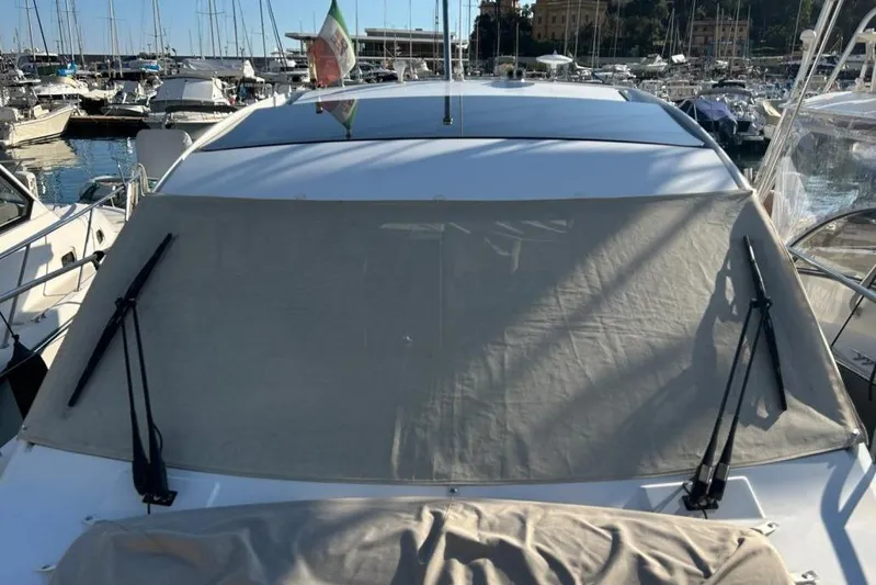  Yacht Photos Pics 2022 Sealine C335V yacht with covered windshield in a marina setting.