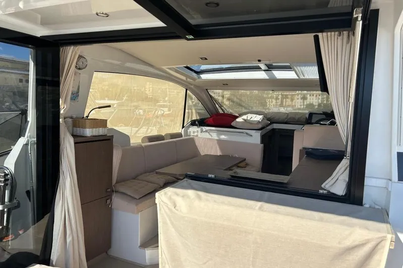  Yacht Photos Pics Interior of 2022 Sealine C335V yacht, featuring modern seating and large windows.