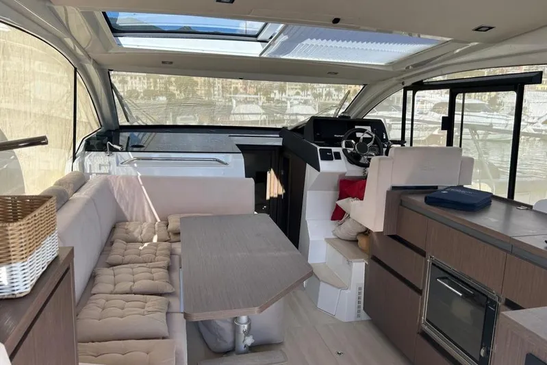  Yacht Photos Pics Interior of 2022 Sealine C335V yacht with modern seating and helm.