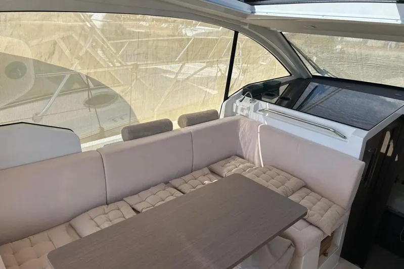  Yacht Photos Pics Interior of 2022 Sealine C335V yacht with plush seating and modern design.