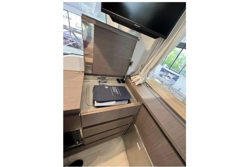  Yacht Photos Pics Modern kitchen area in 2022 Sealine C335V yacht with sleek cabinetry and appliances.