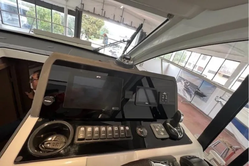  Yacht Photos Pics Control panel of 2022 Sealine C335V boat with navigation equipment.