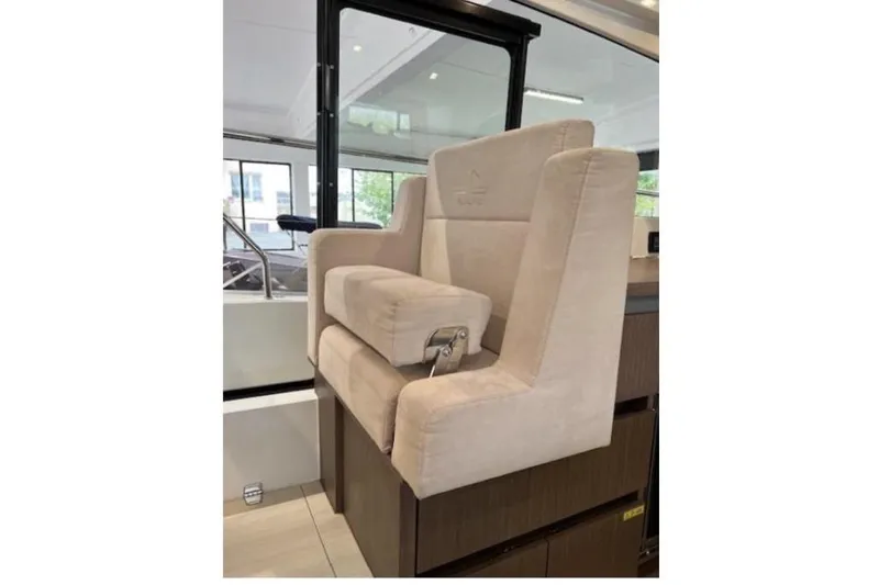  Yacht Photos Pics Captain's seat on 2022 Sealine C335V yacht, featuring beige upholstery and modern design.