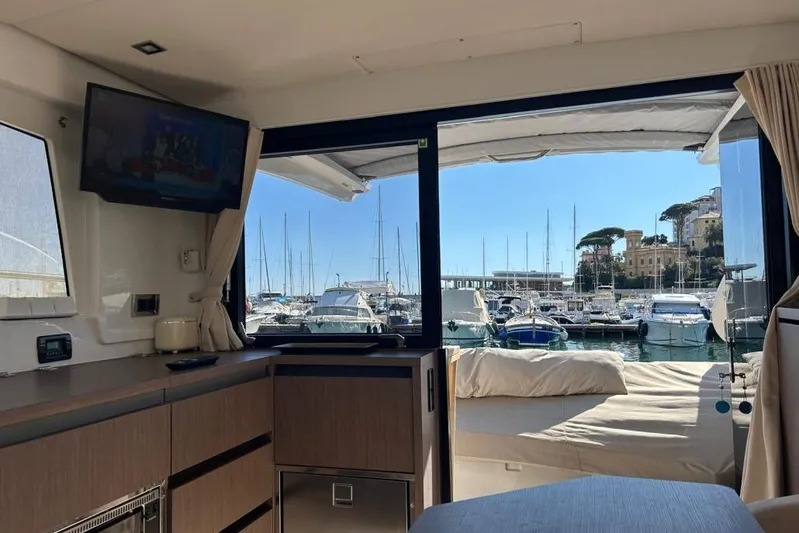  Yacht Photos Pics Interior view of 2022 Sealine C335V yacht with marina backdrop.